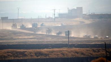 Turkish armoured vehicles on Fri drove through country roads across the border to join the Russians _Kemal Aslan_Reuters
