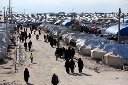 Women walk at al-Hol displacement camp in Hasaka governorate